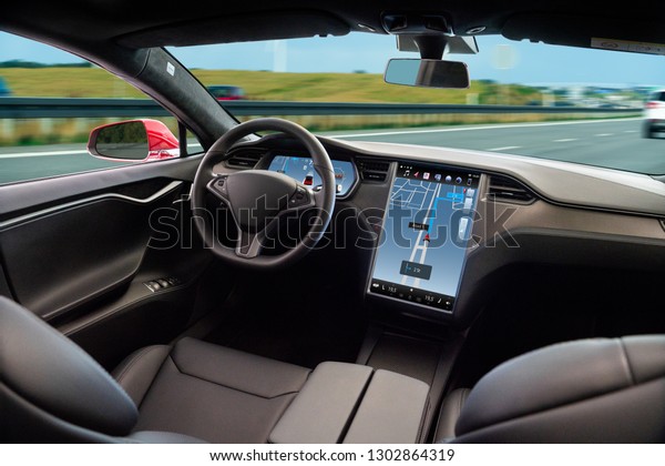 Self driving car on a road. Autonomous vehicle.\
Inside view.