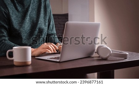 self employed woman work on laptop at home. remote work at home office