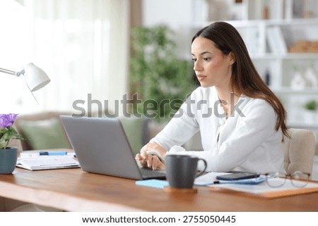Self employed working online using personal computer at home