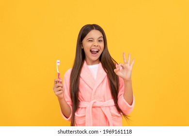 Self Hygiene. Daily Habit. Happy Teen Girl Hold Toothbrush. Childhood Happiness. Morning Routine. Kid Wear Soft Night Suit. Child In Cozy Sleepwear Brush Teeth. Dental Health And Beauty. Oral Care.