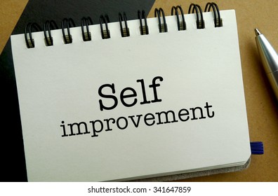 Self Improvement Memo Written On A Notebook With Pen