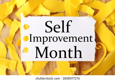 Self Improvement Month, Text On White Paper Over Yellow Torn Paper Background.