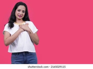 Self Love Concept. Isolated Over Red Pink Background. Positive, Smiling Confident. Self Love And Self Care. Woman In Self Love. Indian Woman Eye Closed Giving Cute And Lovely Expression.