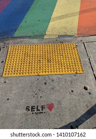 Self Love Graffiti Next To Rainbow Crosswalk In Atlanta, Georgia