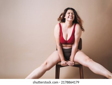 Self Loving Young Woman Plus Size In Underwear Sitting On Beige Background, Body Love