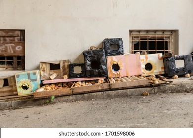 A Lot Of Self Made Cat Shelters For Stray Cats Made. By Volunteers In Downtown Dubrovnik, Dalmatia, Croatia. Cat Hotel Consisting Out Of Cardboard, Wood And Scrap Materials