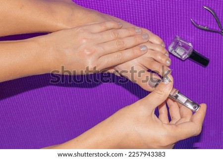 Self Manicure process. Nail file and manicure tools. Manicure and pedicure in a beauty salon, close-up