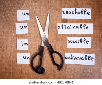 Self Motivation Concept. Negative Words Cut With Scissors And Became Positive.