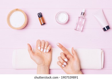 Self Nail Care At Home, Woman's Hands Apply Cuticle Cream After Manicure Procedure, Top View.