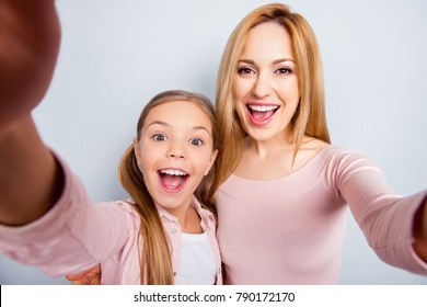 Self Portrait Of Crazy, Foolish Mother And Daughter With Open Mouth, Laughing, Together Making Selfie On Mobile Phone Over Gray Background, Spending, Celebrate Happy Woman's Day