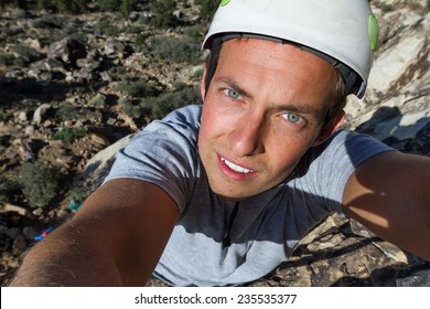 Self Portrait Of A Happy Young Man Rock Climbing In Southern Utah