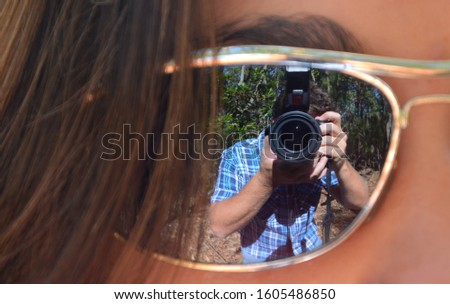 
Self portrait using reflection of model's glasses