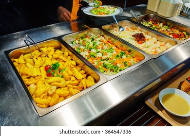 Self service restaurant with a variety of salads, soups and side dishes