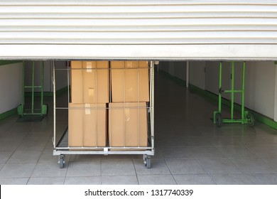 Self storage facility entrance. Trolley cart with boxes - Shutterstock ID 1317740339