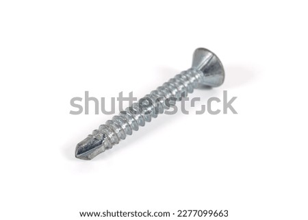 Self tapping metal screw isolated on white background. Stainless steel countersunk self tapping, drilling screws bolts