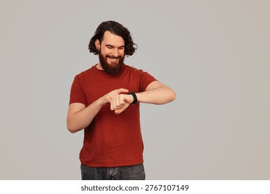 Selfassured Entrepreneur Balancing Tasks While Reviewing His Wristwatch Confidently