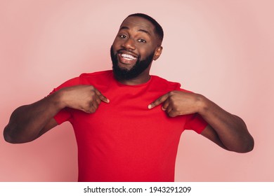 Self-confident dark skin man point finger himself isolated over pink background