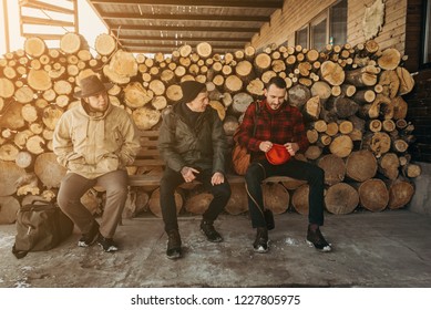 Self-confident Photographer Does Portrait Of Man By The Phone On Background Of Sawmill And Warehouse Of Trees