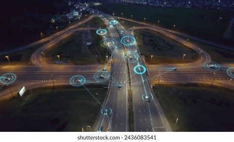 Self-driving autonomous cars move along a suburban traffic intersection in the evening. Neon HUD elements visualize the interaction of driverless cars connected to a common network	

 - Powered by Shutterstock