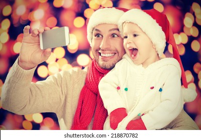 Selfe  In Christmas. Happy Family Dad Playing With Daughter And Photographed On  Mobile Phone