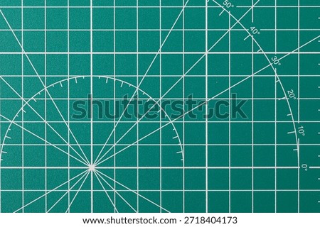 Self-healing cutting mat displaying a precise grid and angle measurements for crafts