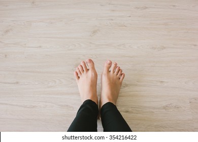 Selfie Of Bare Feet On Wooden Floor Background, Top View