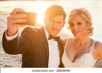 Selfie of bride and groom on a beautiful sunny day - Powered by Shutterstock