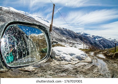 Selfie In The Car Mirror In The Mountains On A Dirt Road