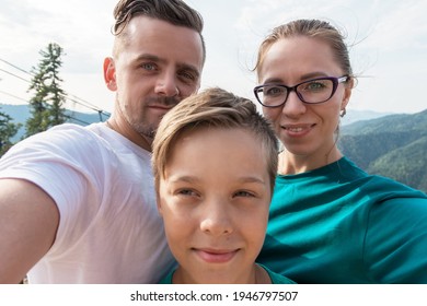 Selfie of family on the Teletskoye lake in Altai mountains, Siberia, Russia. Beauty summer day.