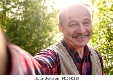 Selfie From Handsome Senior Hispanic Man On Sunny Day.