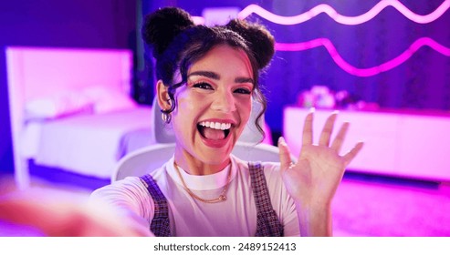 Selfie, influencer and girl with live streaming update in neon bedroom for social media audience, fans or followers. Face of excited content creator, gamer or streamer with wave hello in virtual post