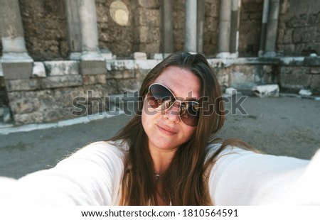 Similar – Woman Walking Through Building