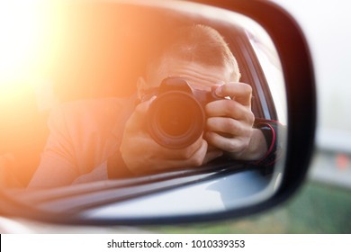 Selfie On The Camera In The Car Mirror. Young Guy