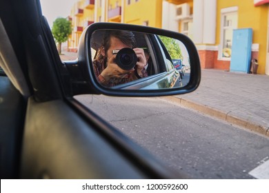 Selfie On The Camera In The Car Mirror. Young Guy