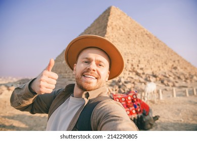 Selfie Photo Archaeologist Man In Hat With Camel Background Pyramid Of Egyptian Giza, Sunset Cairo, Egypt.