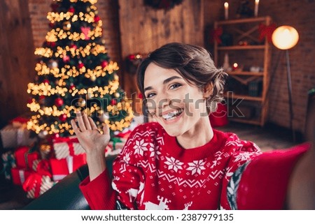 Selfie photo of happy mood young girl brown bob hair wear red sweater hand demonstrate decor preparation noel isolated on home background