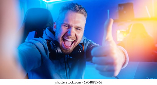 Selfie Photo Happy Professional Gamer Man Smile Playing Tournaments Online Video Games Computer With Headphones.