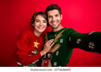 Selfie portrait of two married spouses celebrate noel party photographing isolated vivid color background - Powered by Shutterstock