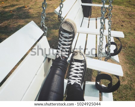 Selfie of sneakers with swing