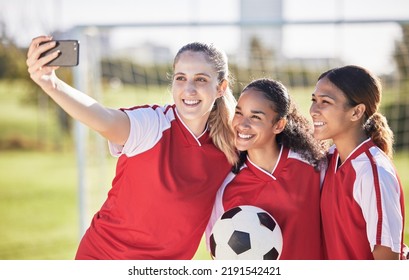 Selfie, Soccer And Sports Team Smiling And Feeling Happy While Posing For A Social Media Picture. Diverse And Young Girls Standing Together On A Football Field. Friends And Teammates Enjoying A