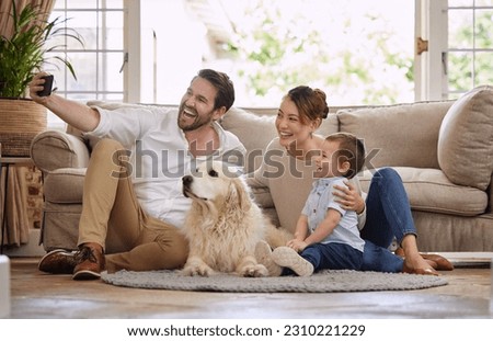 Selfie, social media and happy family in the living room with a dog for internet. Smile, playing and parents, baby and a pet taking a photo for the web, chat or profile picture on the house floor