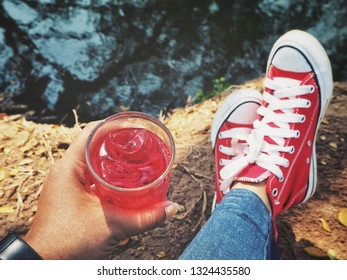 Selfie Of Soft Drink And Red Sneakers