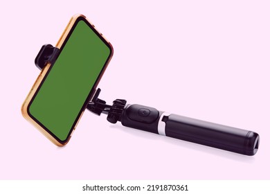 Selfie stick with smart phone isolated on white background. clipping path 