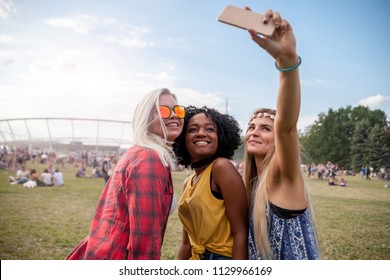 Selfie at summer music festival, group of friends having fun together - Powered by Shutterstock