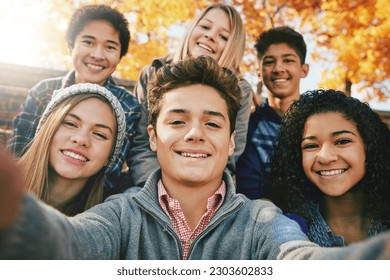 Selfie, teenager and group of friends in park, nature or fall trees and teens smile, picture of friendship and happiness for social media. Portrait, face and happy people together for autumn photo - Powered by Shutterstock