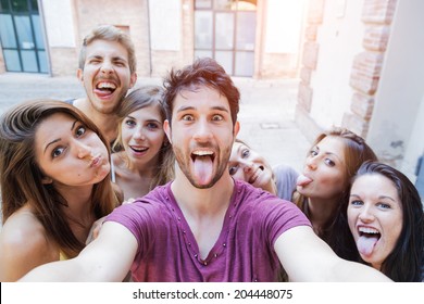 Selfie! teenagers taking pictures in the city - Shutterstock ID 204448075