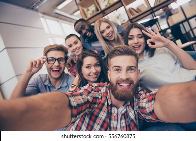 Selfie of young smiling teenagers having fun together - Shutterstock ID 556760875