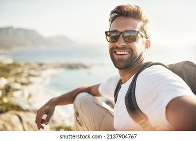 Selfies with a view. Cropped portrait of a handsome young man taking selfies while hiking in the mountains. - Powered by Shutterstock