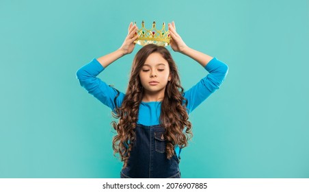 Selfish Kid With Curly Hair In Princess Crown On Blue Background, Egoist