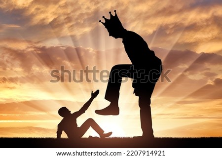 Selfishness. The big man with the crown on his head intends to destroy the little man. The concept of behavior as a selfish tyrant and dictator in business, politics and life. Silhouette Foto d'archivio © 